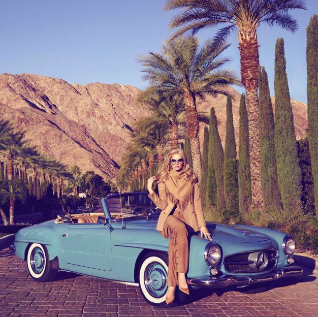 model sitting on a convertible in palm springs
