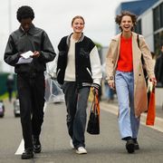 a group of people wearing casual clothes and carrying shopping bags to illustrate a guide to the nordstrom anniversary sale fashion deals for 2023