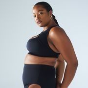 a black woman wearing a black sports bra